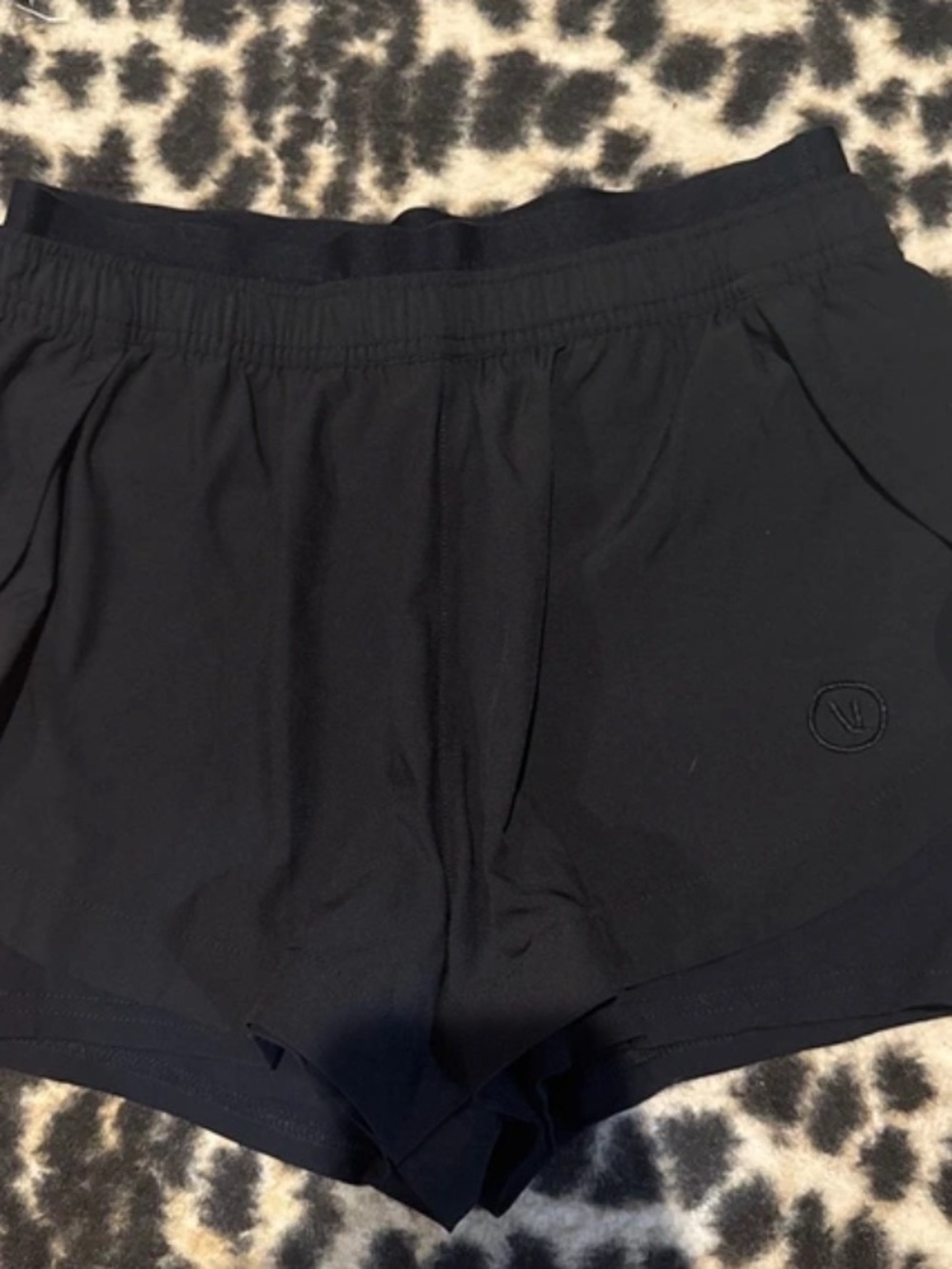 Vuori Women's Black Athletic Shorts with Subtle Logo